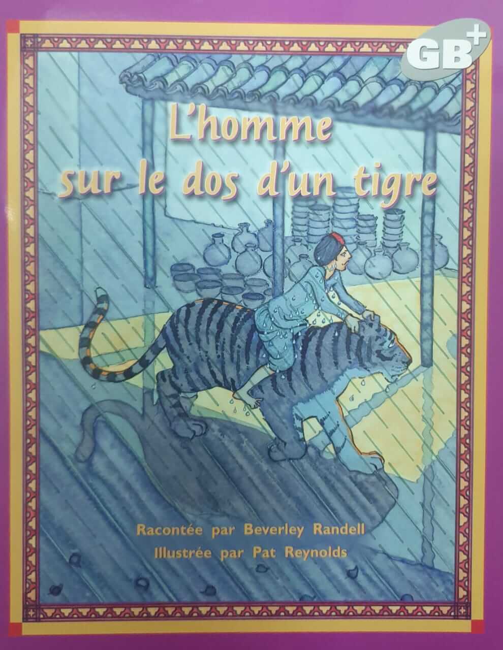 L'homme sur le dos d'un tigre